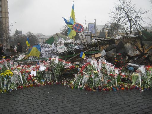 Another memorial, this one against a barricade