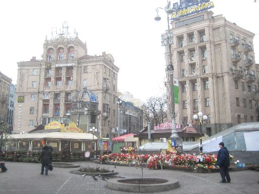 The far side of the square looks similar to how it might during normal times, except for the thousands of flowers placed in memoriam.
