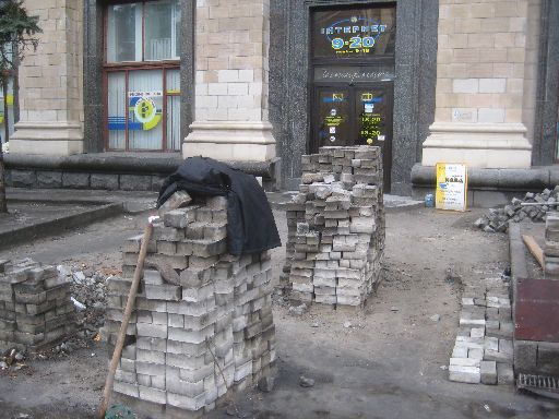 Replacing the sidewalk bricks in front of an Internet café