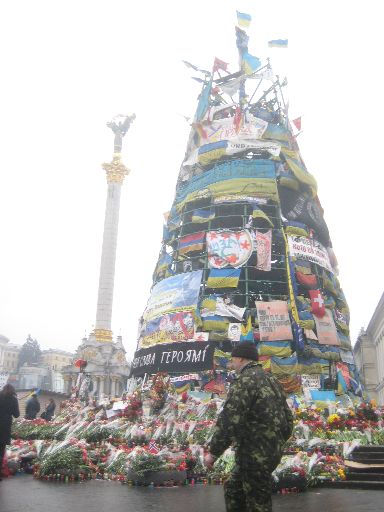 Another view of the 'Christmas tree,' with memorial flowers and candles at the bottom