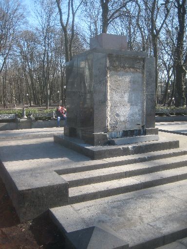 Base with missing statue, plague, and wreath art